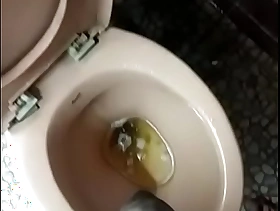 Indian boy pissing in toilet